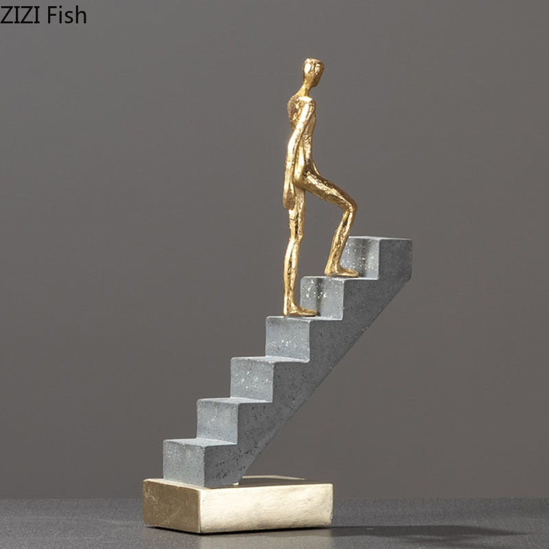 Man Climbing Stairs Statue