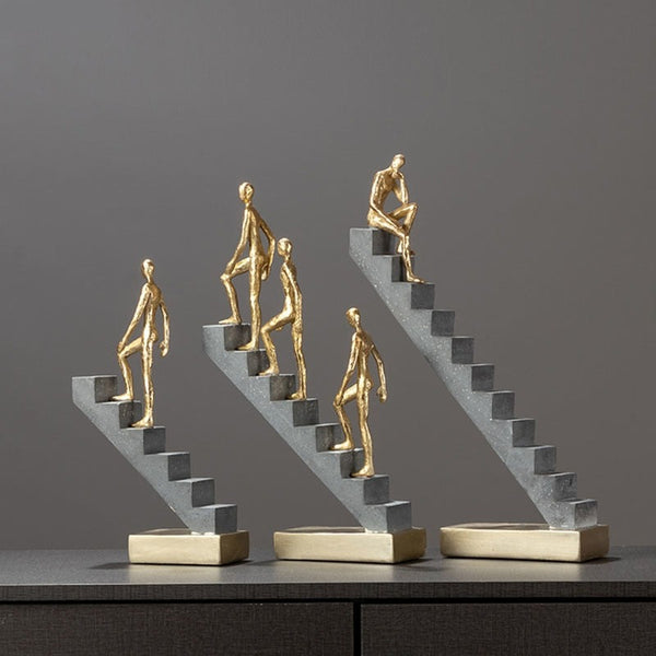 Man Climbing Stairs Statue
