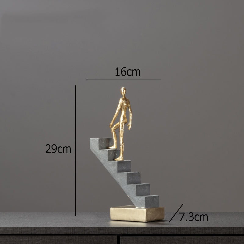 Man Climbing Stairs Statue