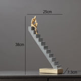 Man Climbing Stairs Statue